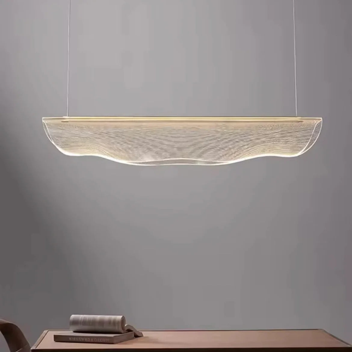 Ethereal Pebble organic LED pendant light above kitchen table